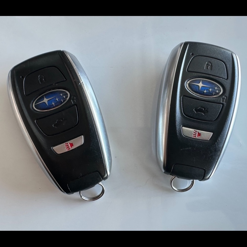 Two re-programmable Subaru Forester key fobs.